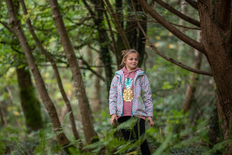 Girl in the forest. stock image. Image of stick, portrait - 214026239