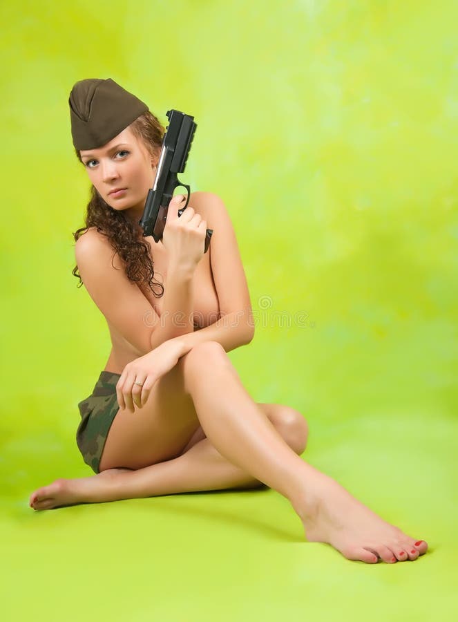 Girl in garrison cap with gun