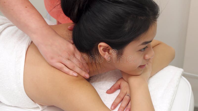 Girl gets massage at the beauty salon.