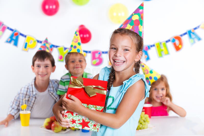 Girl with giftbox at birthday party