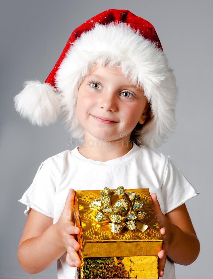 Girl with gifts in santa hat