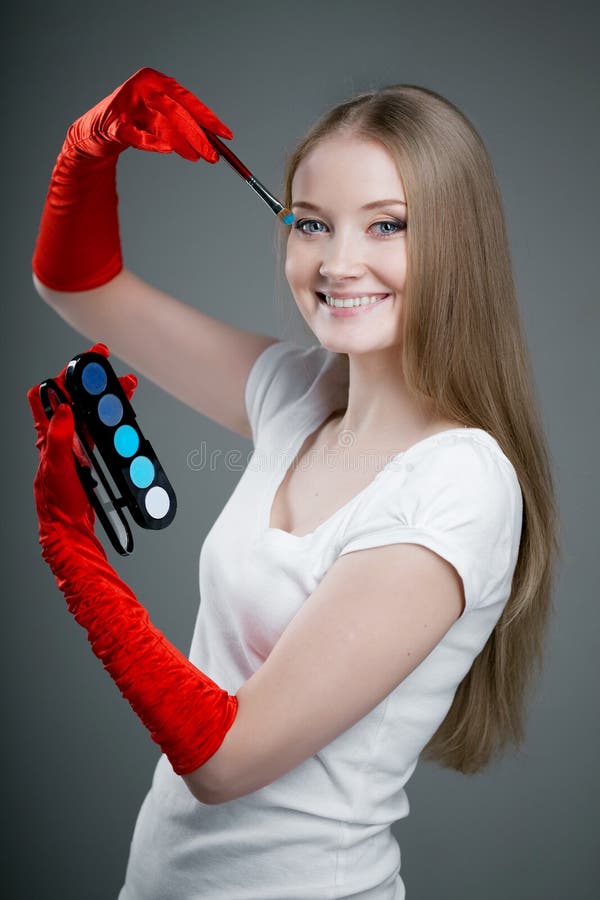 Girl in gloves with brush stock image. Image of color 19418303