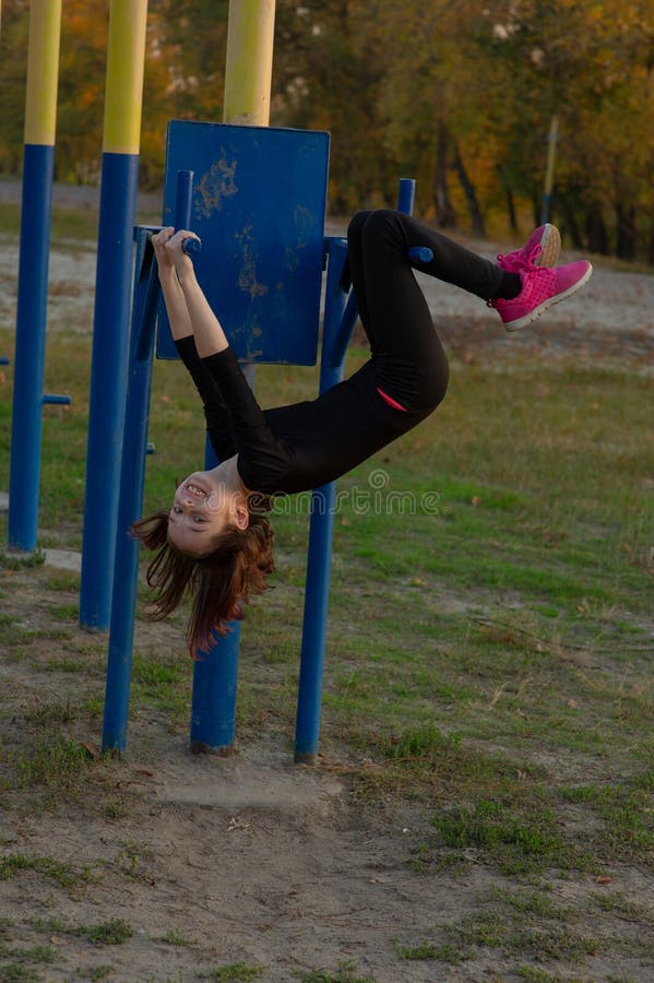 The Girl Goes in for Sports on the Playground on the Street. Morning ...