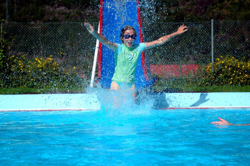 Girl Going Down Slide Into Swimming Pool Stock Image Image of smiling