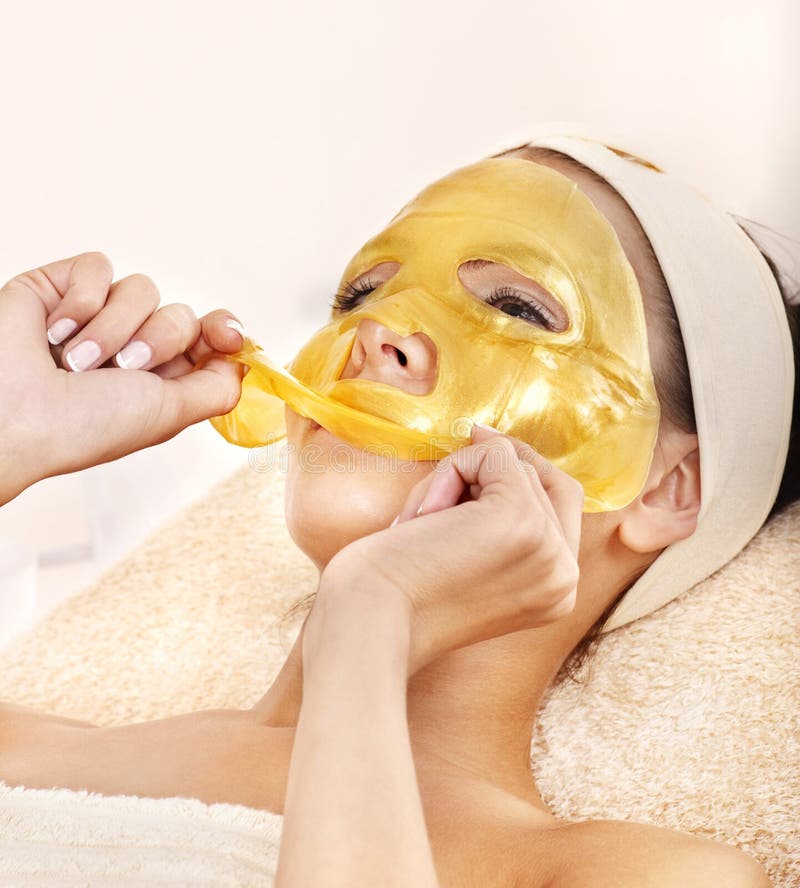 Girl with gold facial mask. stock image Girl with gold facial mask. stock image