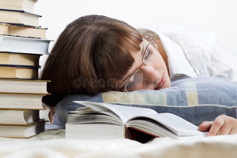 The girl got tired and fell asleep reading a book