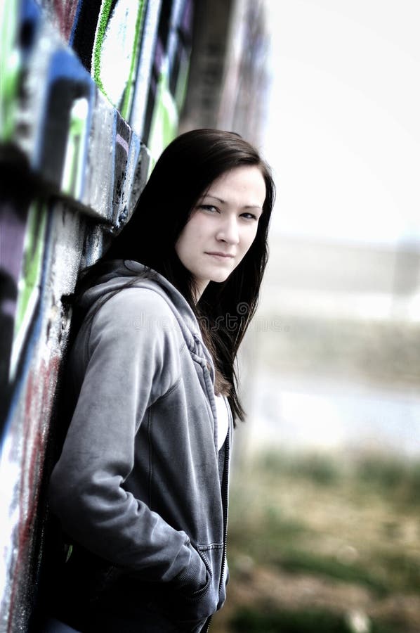 Girl on a graffiti wall