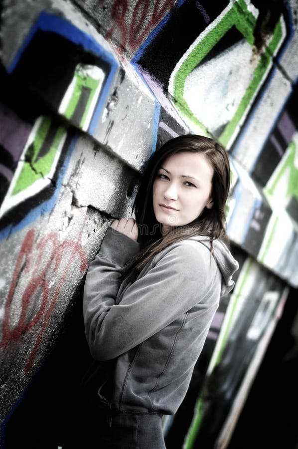 Girl on a graffiti wall