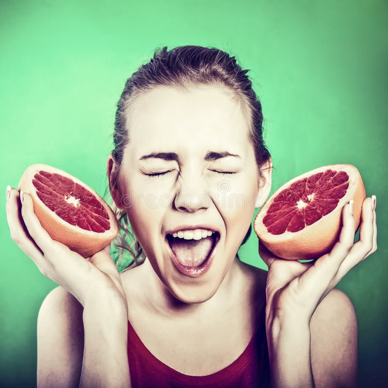 Girl with a grapefruit stock image. Image of face, expression 23802887
