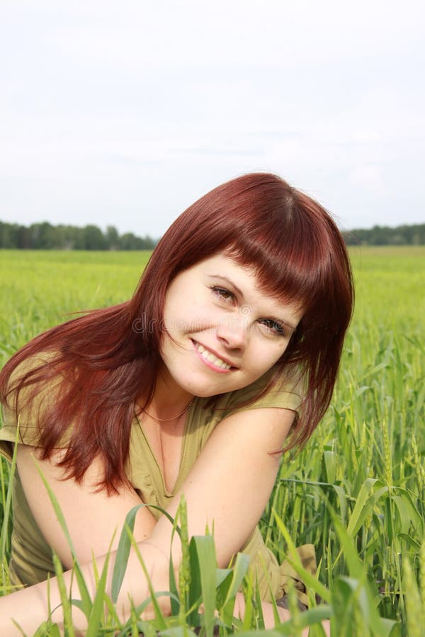 Girl on a green field