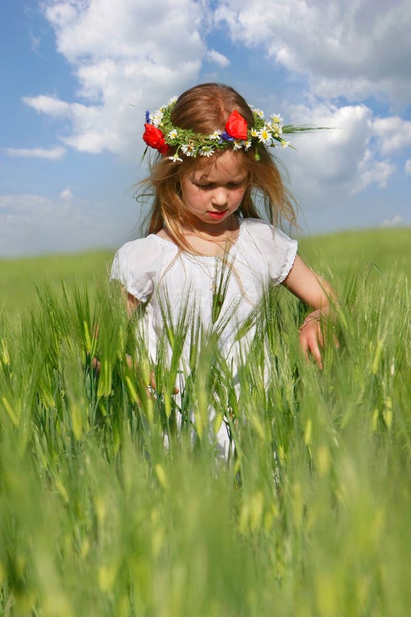 Girl in green field portrait