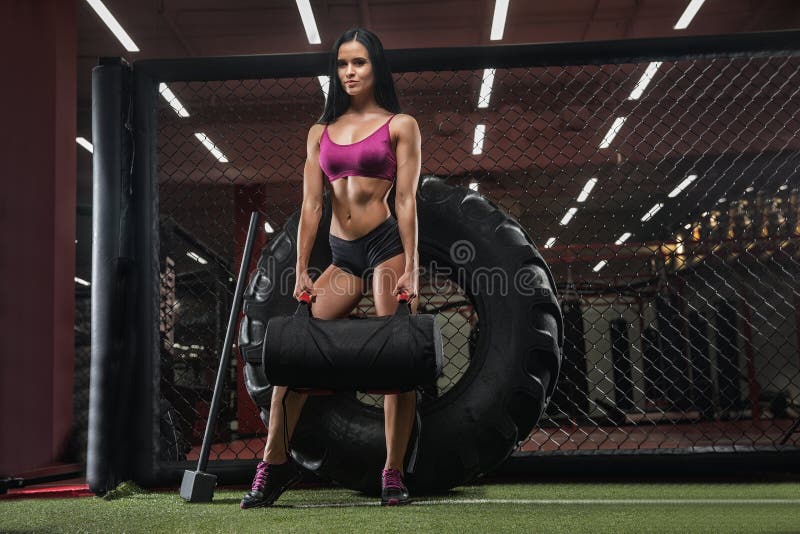 Girl in the gym doing exercises on sports equipment. Girl in the gym doing exercises on sports equipment.