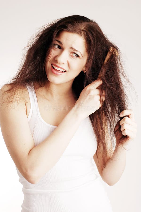 A young pretty woman with hairbrush. A young pretty woman with hairbrush