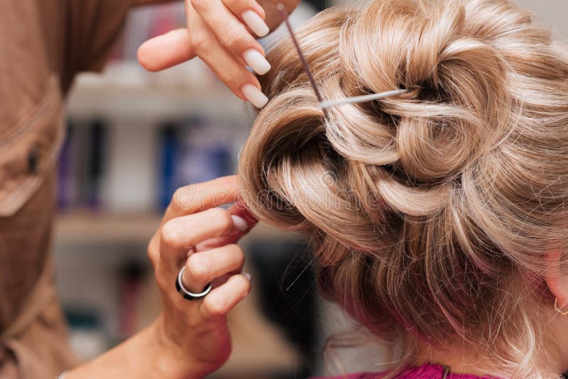 A Girl-hairdresser Makes a Client& X27;s Hairstyle for the Celebration by  Pinning the Strands with Hairpins and Hairpins. Stock Image - Image of  cosmetics, professional: 222080473