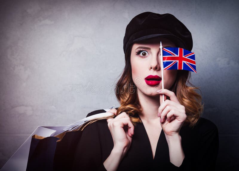 Girl in Hat with Shopping Bags and Flag of United Kingdom Stock Photo ...