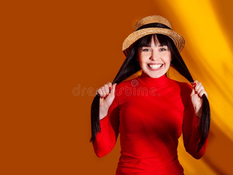 Girl hat sun light shadow tropical yellow orange young woman background red dress tropic royalty free stock images Girl hat sun light shadow tropical yellow orange young woman background red dress tropic royalty free stock images