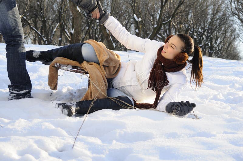 Girl having accident with sledge