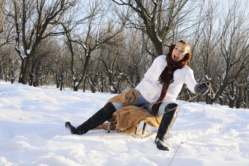 Girl having fun on sledge