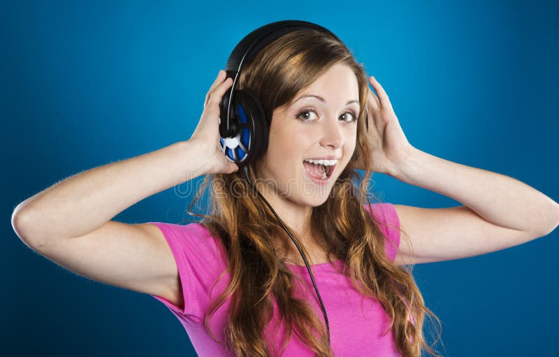 Песни которые слушают подростки. A girl Listening to Music on Headphones.