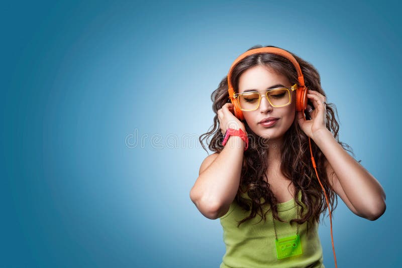 Girl in headphones listening to music.