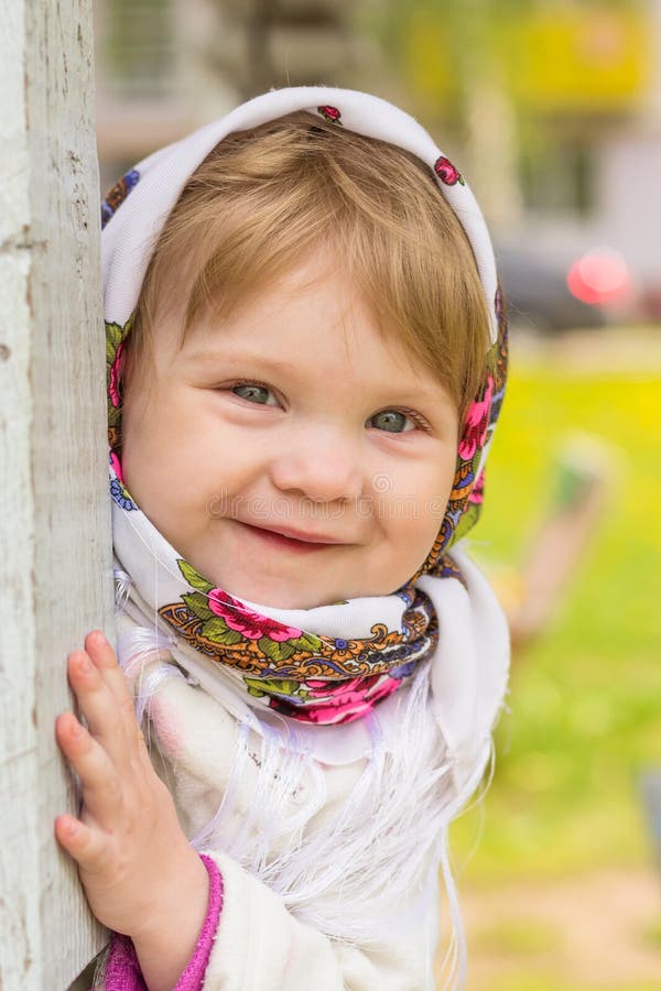 Girl in a headscarf stock photo. Image of little, shawl 55003704