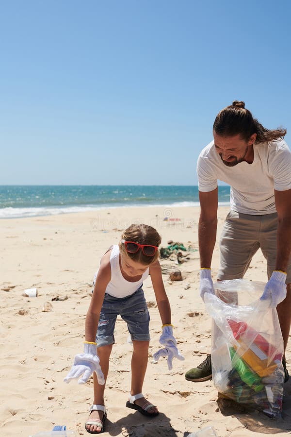 Girl Helping Father To Collect Garbage Stock Photo - Image of father ...