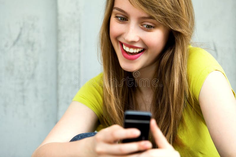 Girl with her mobile phone. Woman Using Mobile Phone, smiling Girl with her mobile phone. Woman Using Mobile Phone, smiling