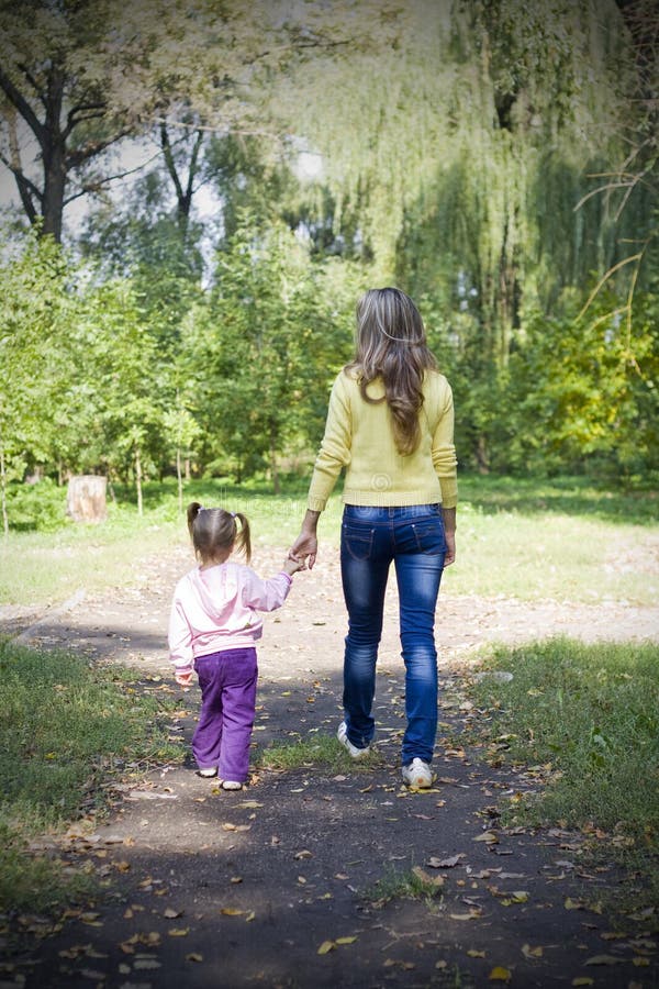 Girl and her mother in Autumn Park