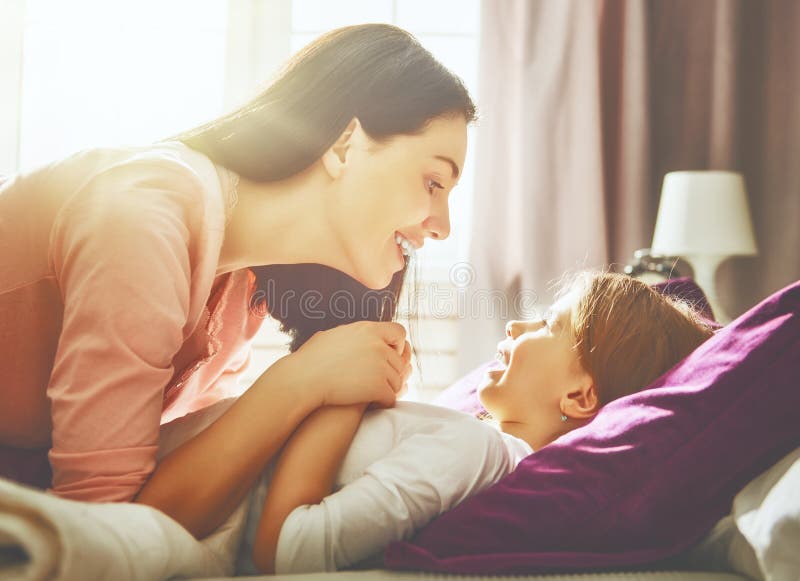 Mother Wakes Her Daughter In Bed In Morning Stock Image Image Of