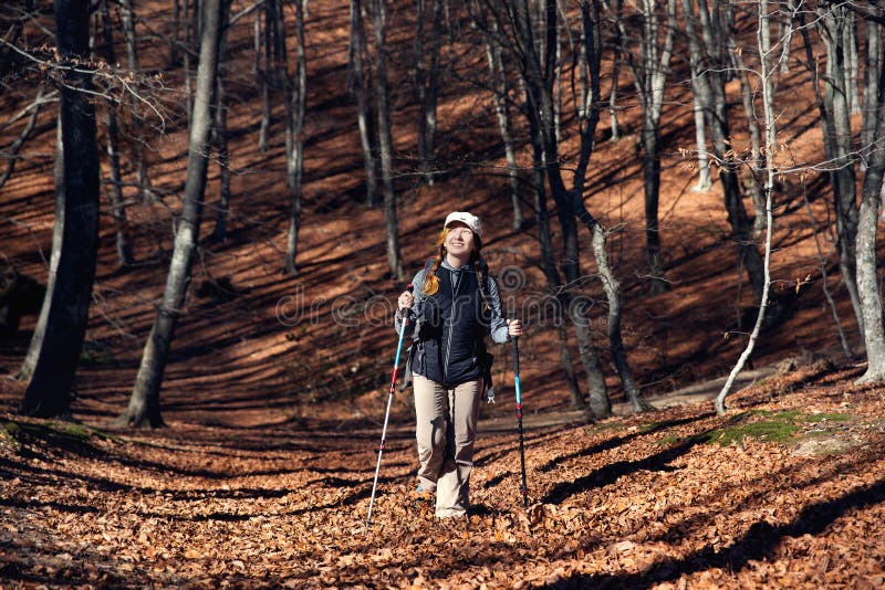A Girl in Hiking Clothes Photographs Landscapes in the Mountains