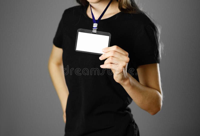 Girl holding a badge. Close up. Isolated background royalty free stock photos Girl holding a badge. Close up. Isolated background royalty free stock photos