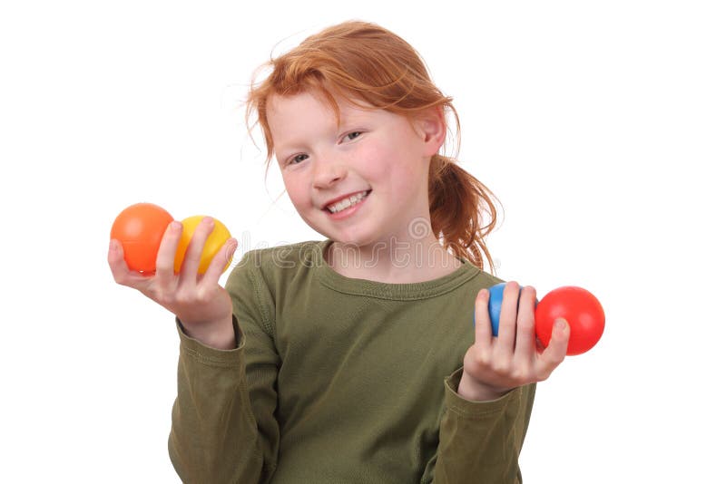 Girl holding balls stock image. Image of look, face, little 24469837