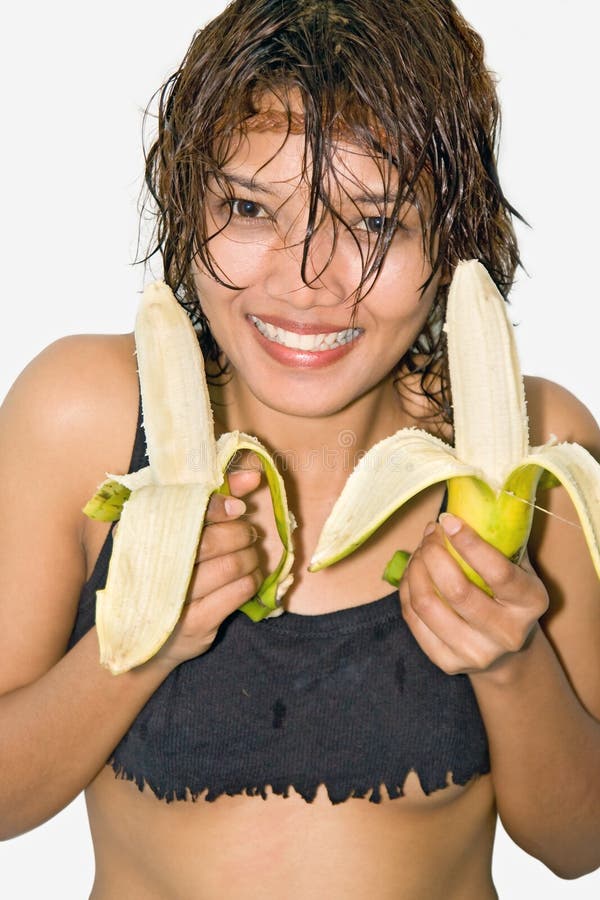 Girl holding a banana.