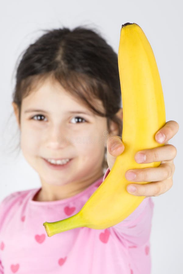 Girl holding banana fruit stock photo. Image of person 84529172