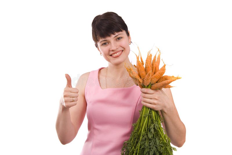 Girl holding bunch of carrots