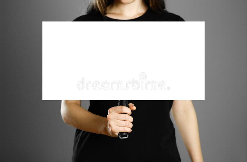Girl holding a cardboard sign with a handle. Close up. Isolated background royalty free stock image Girl holding a cardboard sign with a handle. Close up. Isolated background royalty free stock image
