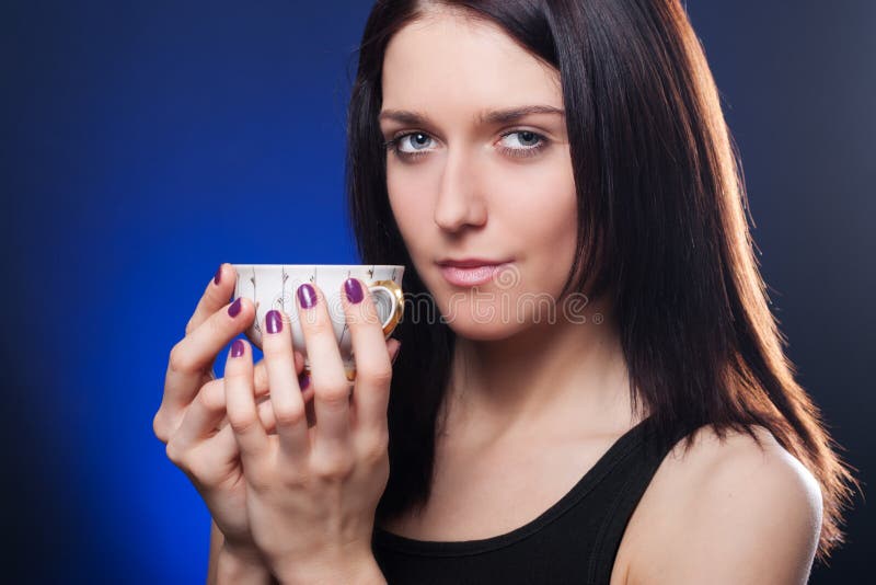 Girl holding cup of tea stock image. Image of hair, lifestyle 18581725