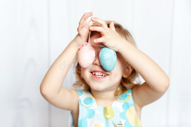 Girl holding Easter eggs