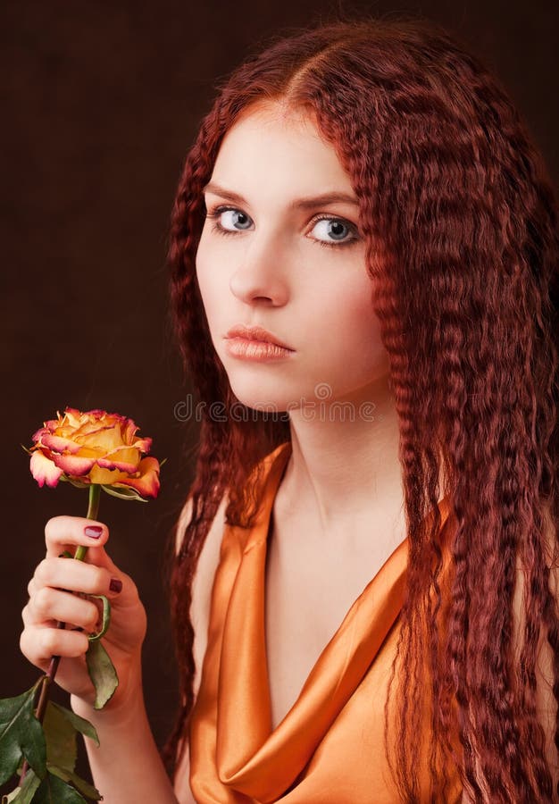 Girl holding a flower