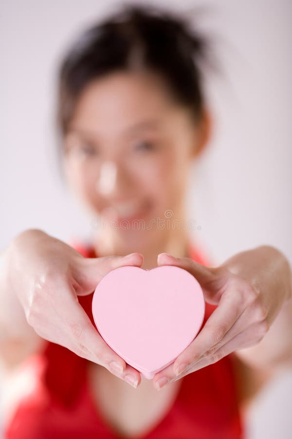 girl holding heart shape box