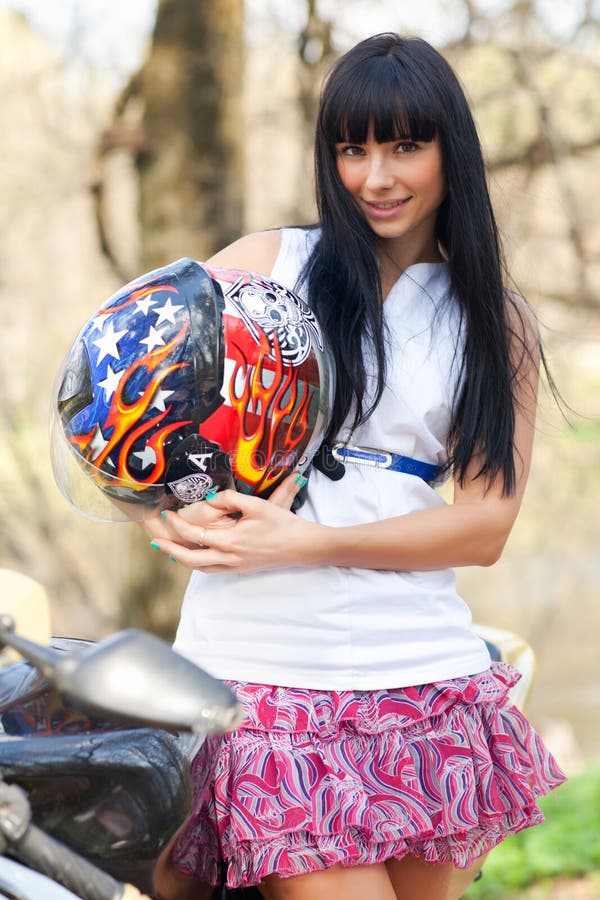 Girl holding a helmet