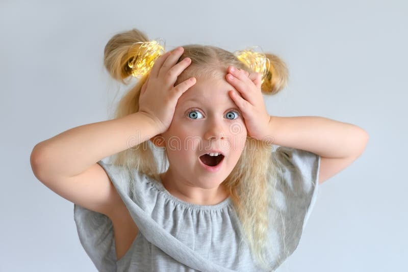 Girl is Holding Her Head in Surprise Stock Photo Image of child
