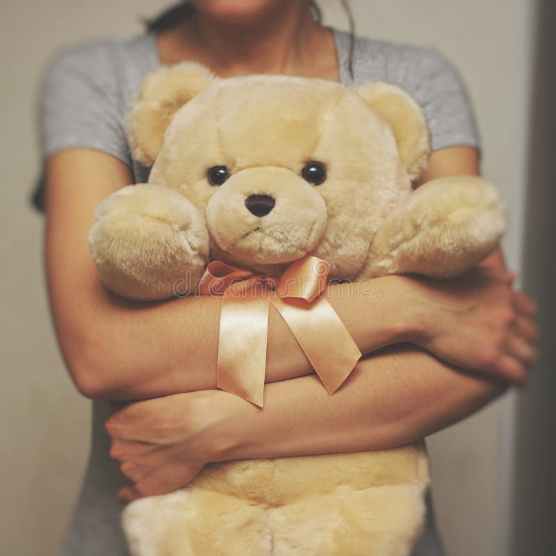 A Girl is Holding and Hugging a Teddy Bear. Concept Idea - Goodbye To ...