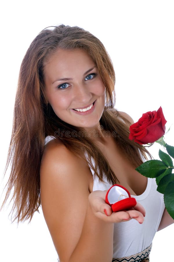 Girl holding jewellery gift box and flower.