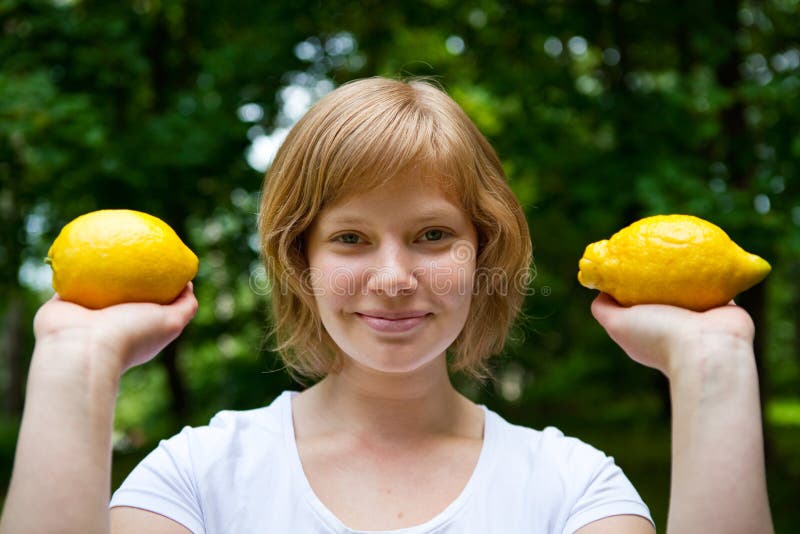 Girl holding lemons stock photo. Image of natural, closeup 14919460