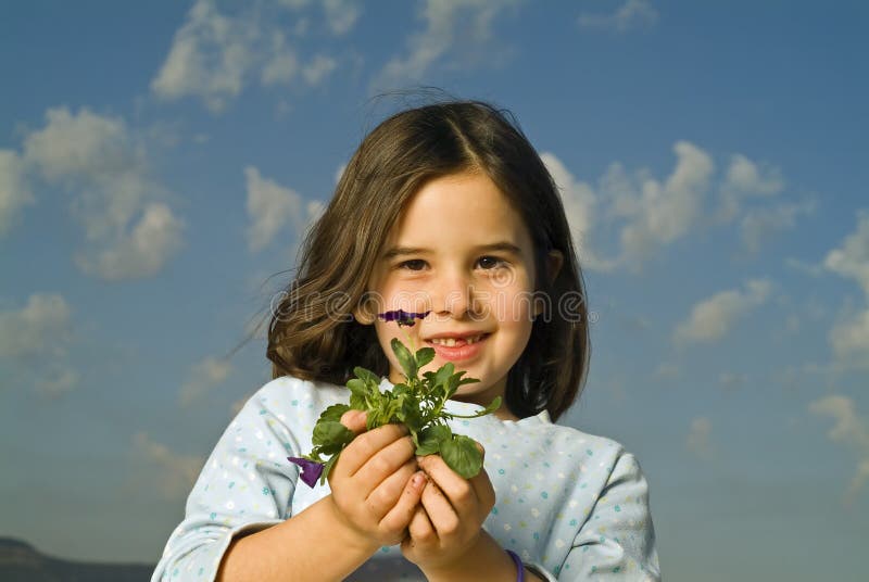 Girl holding plant