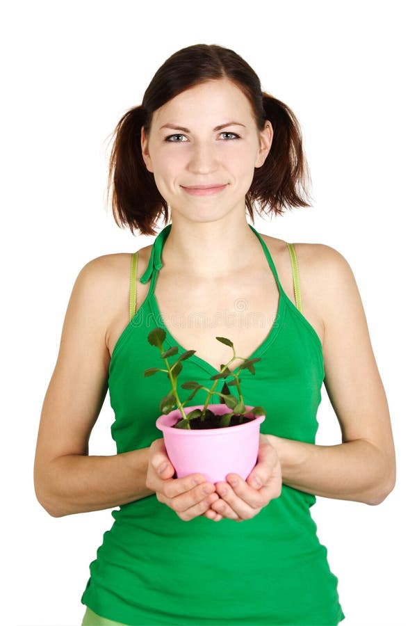Girl holding potted plant and smiling