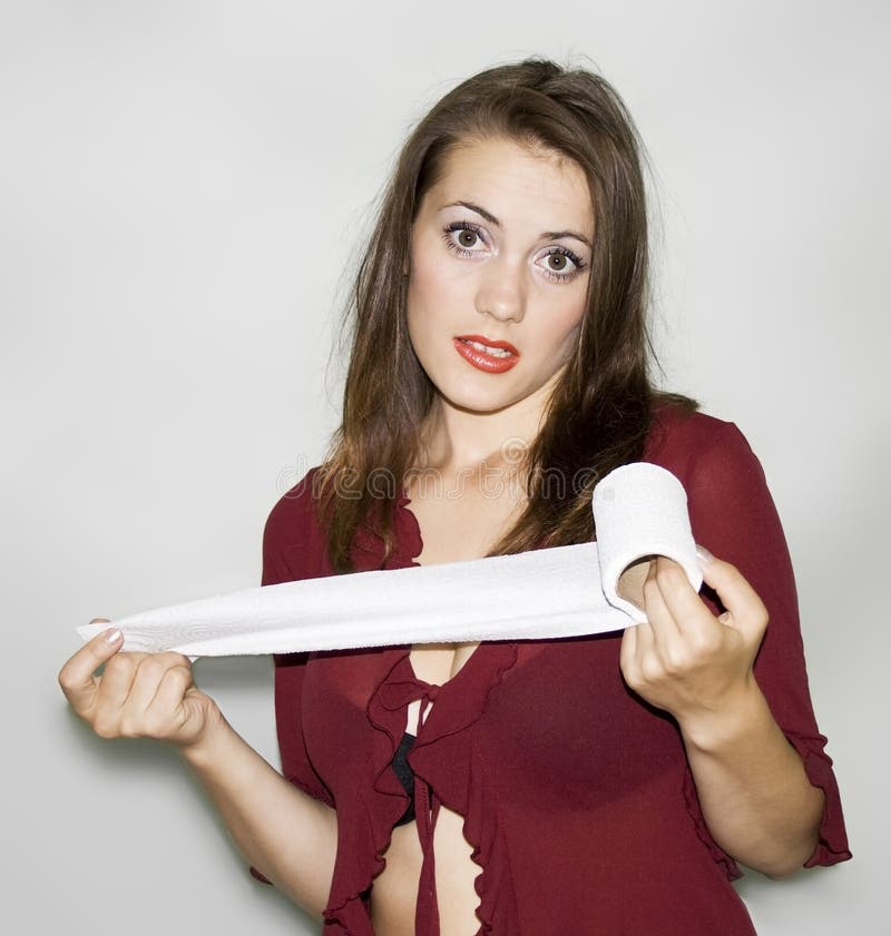 Girl holding a roll of toilet paper.