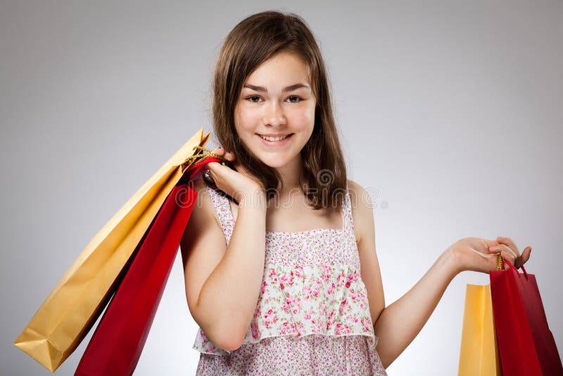 Girl holding shopping bag stock image. Image of adolescent 20634943