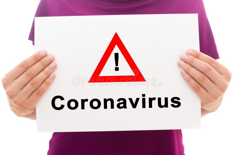 Girl holding white paper sheet with text Corona Virus
